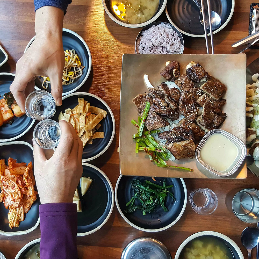 Eating Korean food like MOA Korean BBQ and Bar, the top rated restaurant in Columbia SC