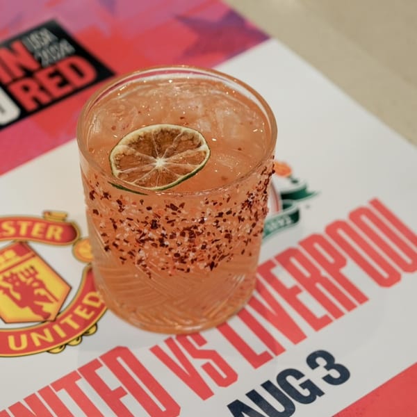 A MOA Korean BBQ & Bar cocktail with a chili-salt rim and lime slice on a promotional flyer.